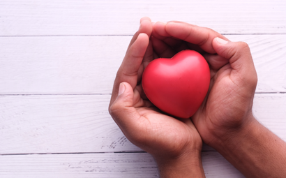 Hands holding a red heart