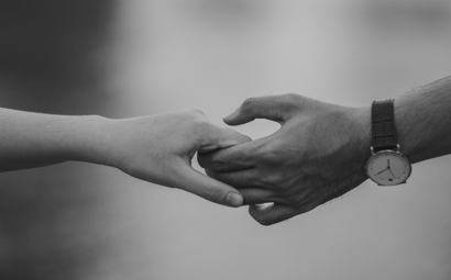 Monochrome Photo of Couple Holding Hands